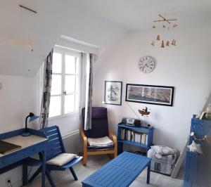 a room with a desk and a chair and a window at La goélette - Les Gîtes de la Côte d'Amour in Le Croisic +14 photos