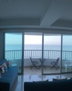 a living room with a view of the ocean at Apartamento con vista al mar piso 19 Bocagrande in Cartagena de Indias