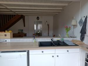 a kitchen with a sink and a counter at Location maison de ville à 5 minutes du Puy du Fou ! in Chambretaud