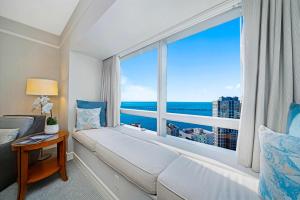 a room with a large window with a bed and a couch at 1435 Brickell Ave 3004 in Miami +169 photos
