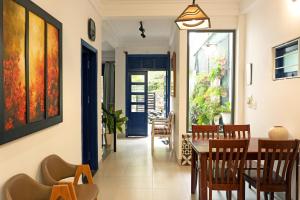 a dining room with a table and chairs at Thiên Trúc Ecohome, đồi Từ Hiếu in Thôn Dương Xuân Hạ +26 photos