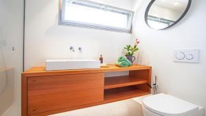 A bathroom at A Factoria Beach House by Prishomes
