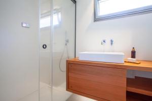 A bathroom at A Factoria Beach House by Prishomes