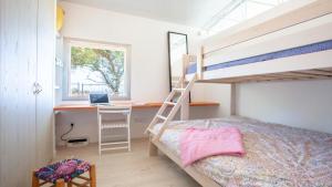 A bed or beds in a room at A Factoria Beach House by Prishomes