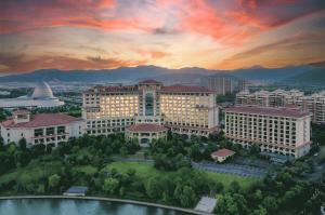 an aerial view of a building at sunset at DoubleTree by Hilton Ningbo - Chunxiao in Ningbo