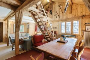 a living room with a spiral staircase in a tiny house at Chalet Spouter Happy Rentals in Chamonix
