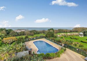 an aerial view of a swimming pool in a yard at Sennen - St Ives in Carbis Bay