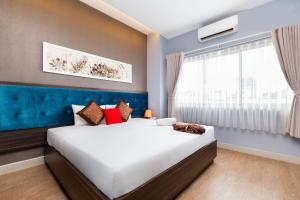 Postel nebo postele na pokoji v ubytování Khách sạn Bamboo Sài gòn