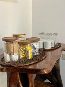 a table with jars and other items on it at Casa Olivia in Coron