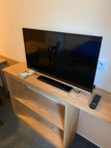 Televízia a/alebo spoločenská miestnosť v ubytovaní Horský Hotel Skiland