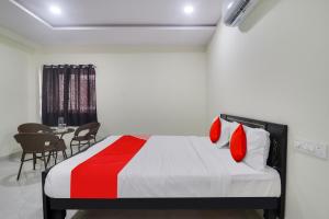 Posteľ alebo postele v izbe v ubytovaní OYO Flagship Hotel Vj Residency