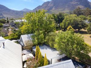 an aerial view of a house with mountains in the background at Maison Dandelion in Franschhoek