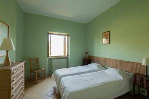 a green bedroom with a bed and a window at Villa Flavia in Manziana +34 photos