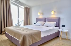 Postel nebo postele na pokoji v ubytování Apartments Magic box II