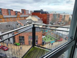 a view from a window of a city with a playground at Stylish 2 bed & 2 bath City Centre Apartment with FREE PARKING in Sheffield