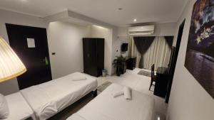 Voodi või voodid majutusasutuse Helio Cairo Hotel toas