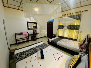 Letto o letti in una camera di Lucky Villa Sigiriya