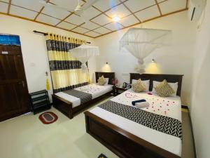 Letto o letti in una camera di Lucky Villa Sigiriya