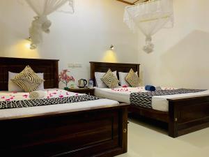 Letto o letti in una camera di Lucky Villa Sigiriya