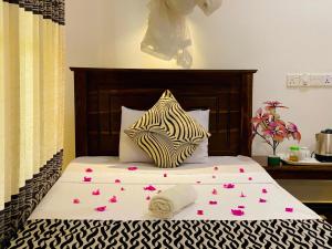 Letto o letti in una camera di Lucky Villa Sigiriya