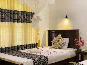 Letto o letti in una camera di Lucky Villa Sigiriya