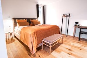 Voodi või voodid majutusasutuse Sixtus Sinatur Hotel & Konference toas
