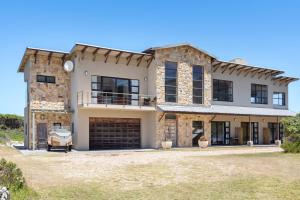 an image of a house with a garage at Hangklip Villa by Host Agents in Pringle Bay +35 photos