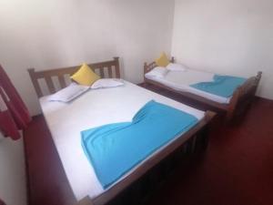 Postel nebo postele na pokoji v ubytování Sunshine Guest House