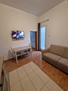 a living room with a couch and a table at CHIOGGIA PLAYA in Chioggia