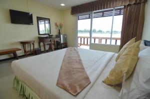 Postel nebo postele na pokoji v ubytování Techno Riverview Resort