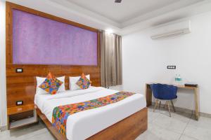 Ένα ή περισσότερα κρεβάτια σε δωμάτιο στο FabHotel The Grand Heritage