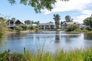 a view of a river with houses at Pearl Valley Golf lodge in Paarl