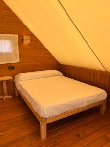 a bedroom with a bed in a attic at BOHO GLAMPING CONIL in Cádiz