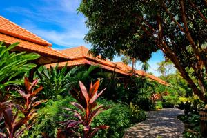 a house with an orange roof and a pathway at Smile House - Fisherman Village in Bophut