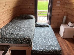 Postel nebo postele na pokoji v ubytování Gateway Resort En-Suite Glamping Pod