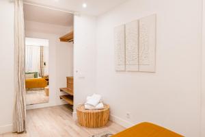 Ein Bett oder Betten in einem Zimmer der Unterkunft Chueca I calle Farmacia 1BR 1BH
