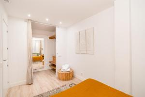 Ein Bett oder Betten in einem Zimmer der Unterkunft Chueca I calle Farmacia 1BR 1BH