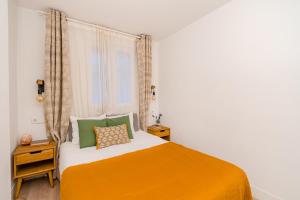 Ein Bett oder Betten in einem Zimmer der Unterkunft Chueca I calle Farmacia 1BR 1BH