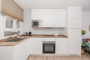 Küche/Küchenzeile in der Unterkunft Chueca I calle Farmacia 1BR 1BH