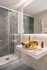a bathroom with a sink and a shower at Modern Apartment Chueca I Renovated 1BR 1BH in Madrid
