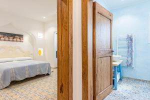 A bed or beds in a room at Terrazza e Conchiglie