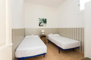 Postel nebo postele na pokoji v ubytování Apartament Clot 1