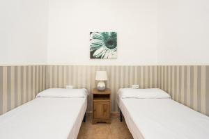 Postel nebo postele na pokoji v ubytování Apartament Clot 1
