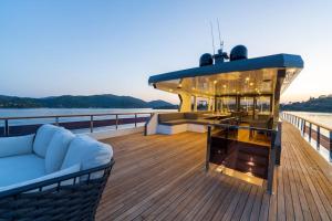 a boat with a couch sitting on the deck at Explorer Yacht in Fethiye