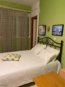 Ένα ή περισσότερα κρεβάτια σε δωμάτιο στο Maria's rooms CHANTZARA SPYROPOULOS Flats to Let-City Center