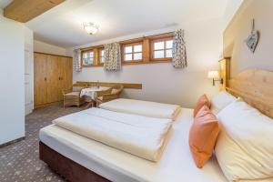 Postel nebo postele na pokoji v ubytování Gästehaus Linsinger