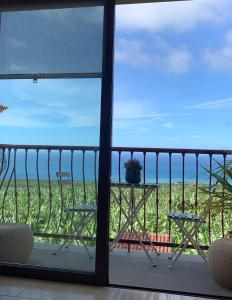 a balcony with a view of the ocean at Apartamento Los Guirres in Tazacorte +48 photos