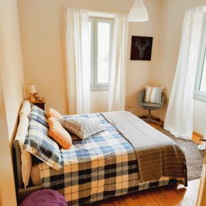 a bedroom with a bed with pillows and a window at Villa Alma, Lake Como Bed&Breathe in San Fedele Intelvi
