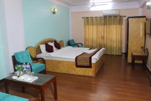Una cama o camas en una habitación de Hotel Mudkhu Durbar