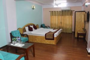 Una cama o camas en una habitación de Hotel Mudkhu Durbar
